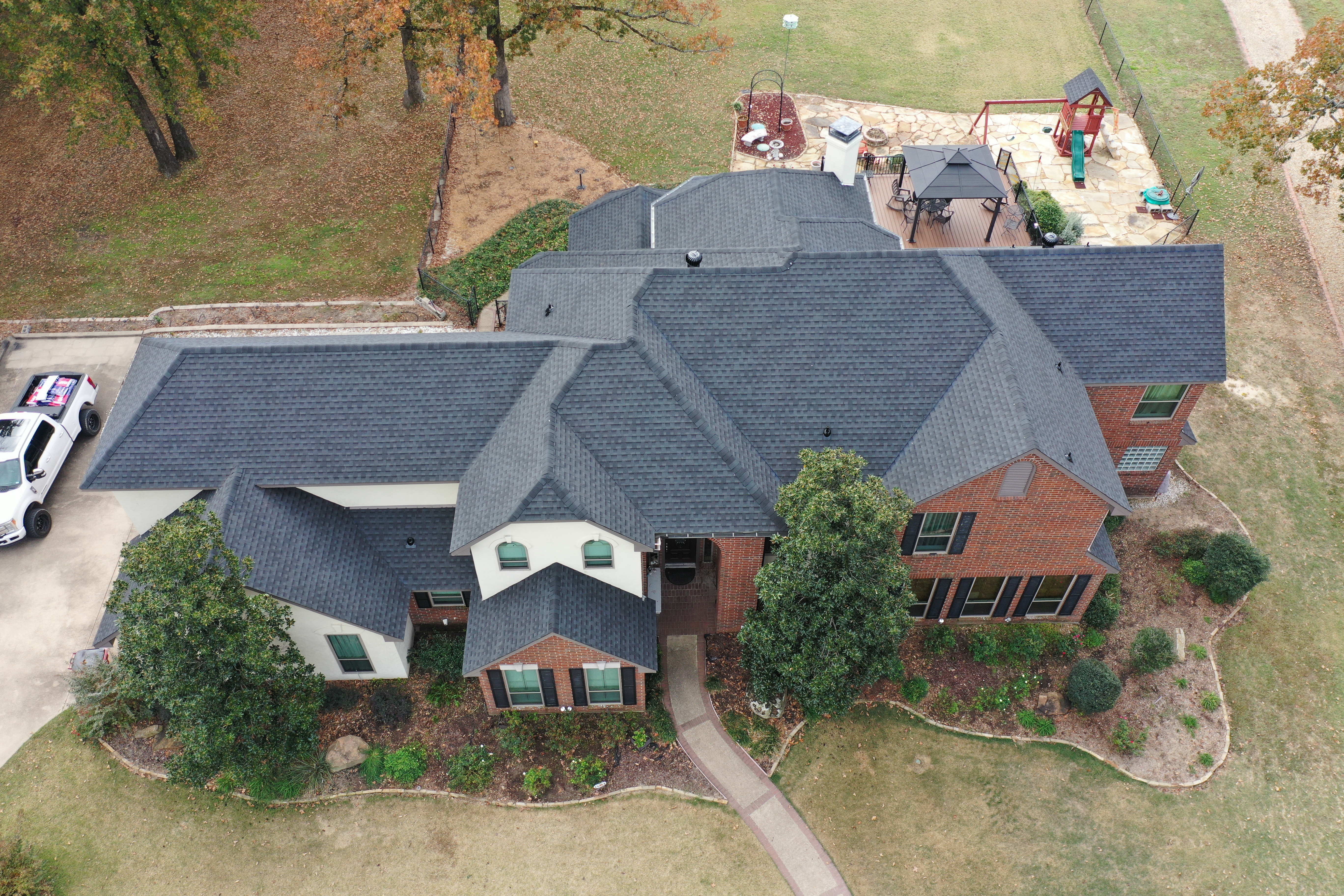 Charcoal architectural shingle roof in Greenville TX by Rubicon Roofing